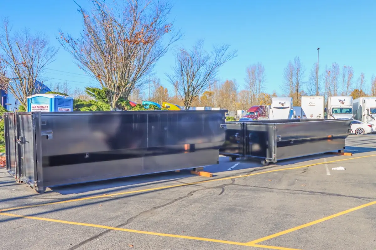 Professional dumpster rental service with roll-off container on residential driveway in Heber Springs